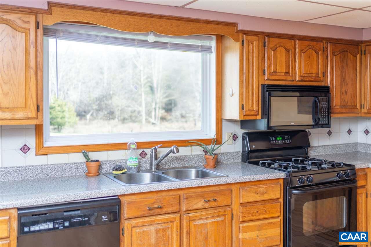 53 McKamy Springs Road Middlebrook, VA 24459 - Photo 10 of 46 a kitchen with a stove a sink and a microwave