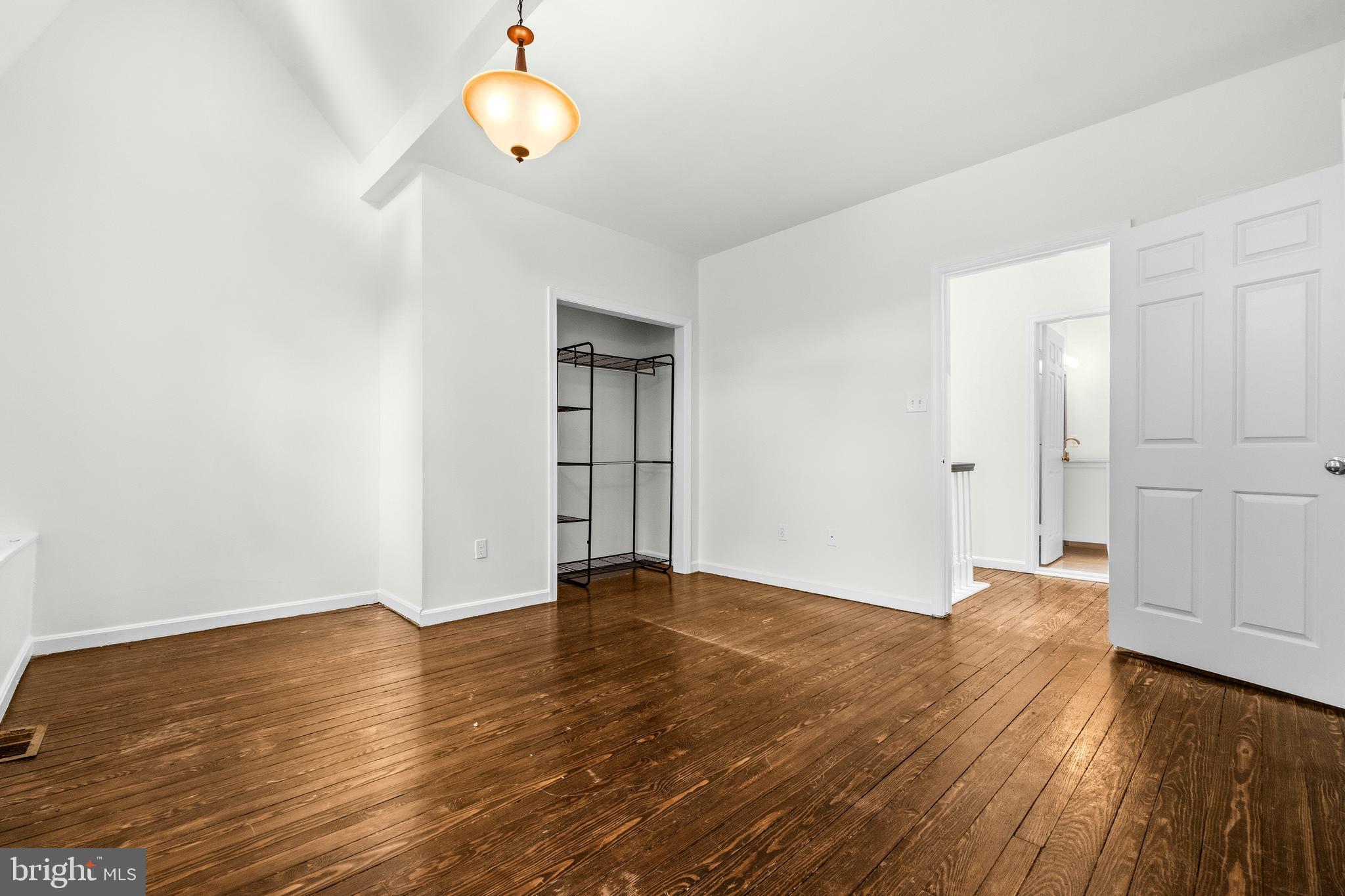 1504 Gales Street Northeast Washington, DC 20002 - Photo 16 of 24 a view of an empty room with wooden floor and a window