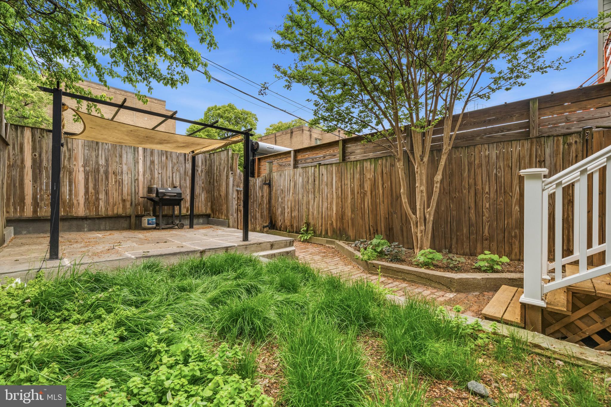 1504 Gales Street Northeast Washington, DC 20002 - Photo 22 of 24 a backyard of a house with table and chairs