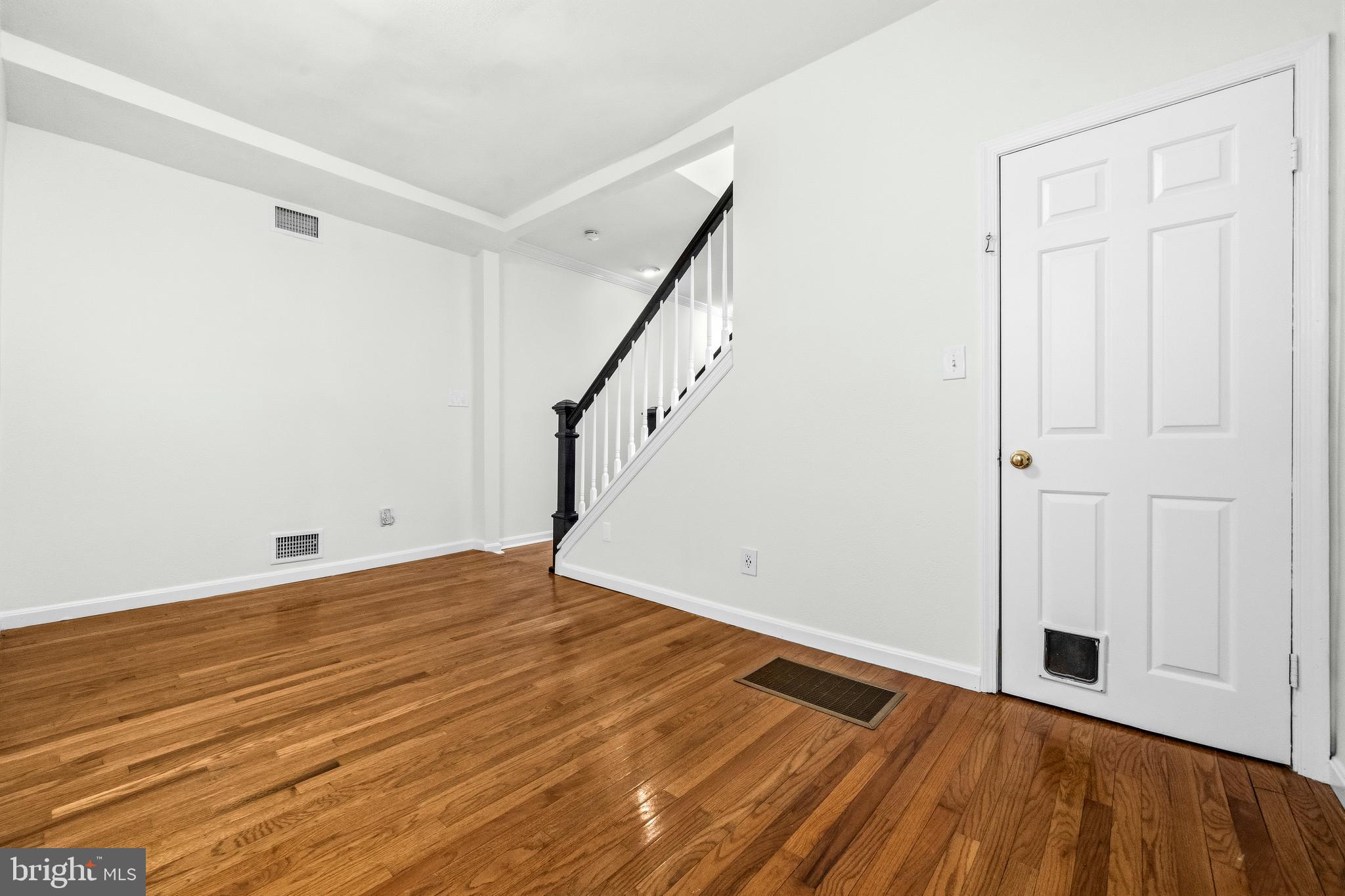 1504 Gales Street Northeast Washington, DC 20002 - Photo 5 of 24 a view of an empty room with wooden floor