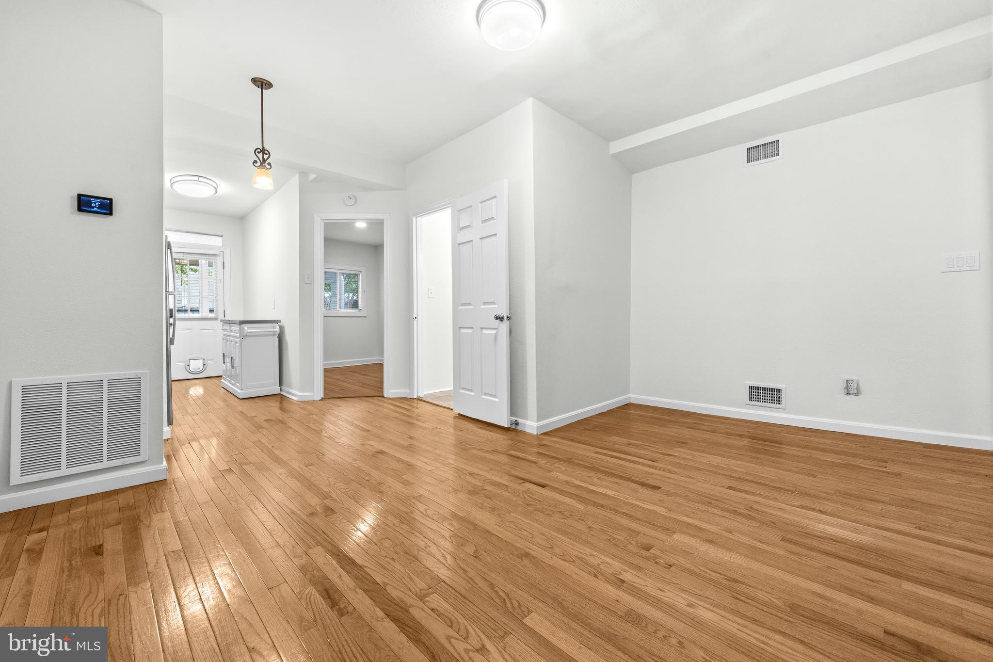 1504 Gales Street Northeast Washington, DC 20002 - Photo 7 of 24 a view of empty room with wooden floor and window