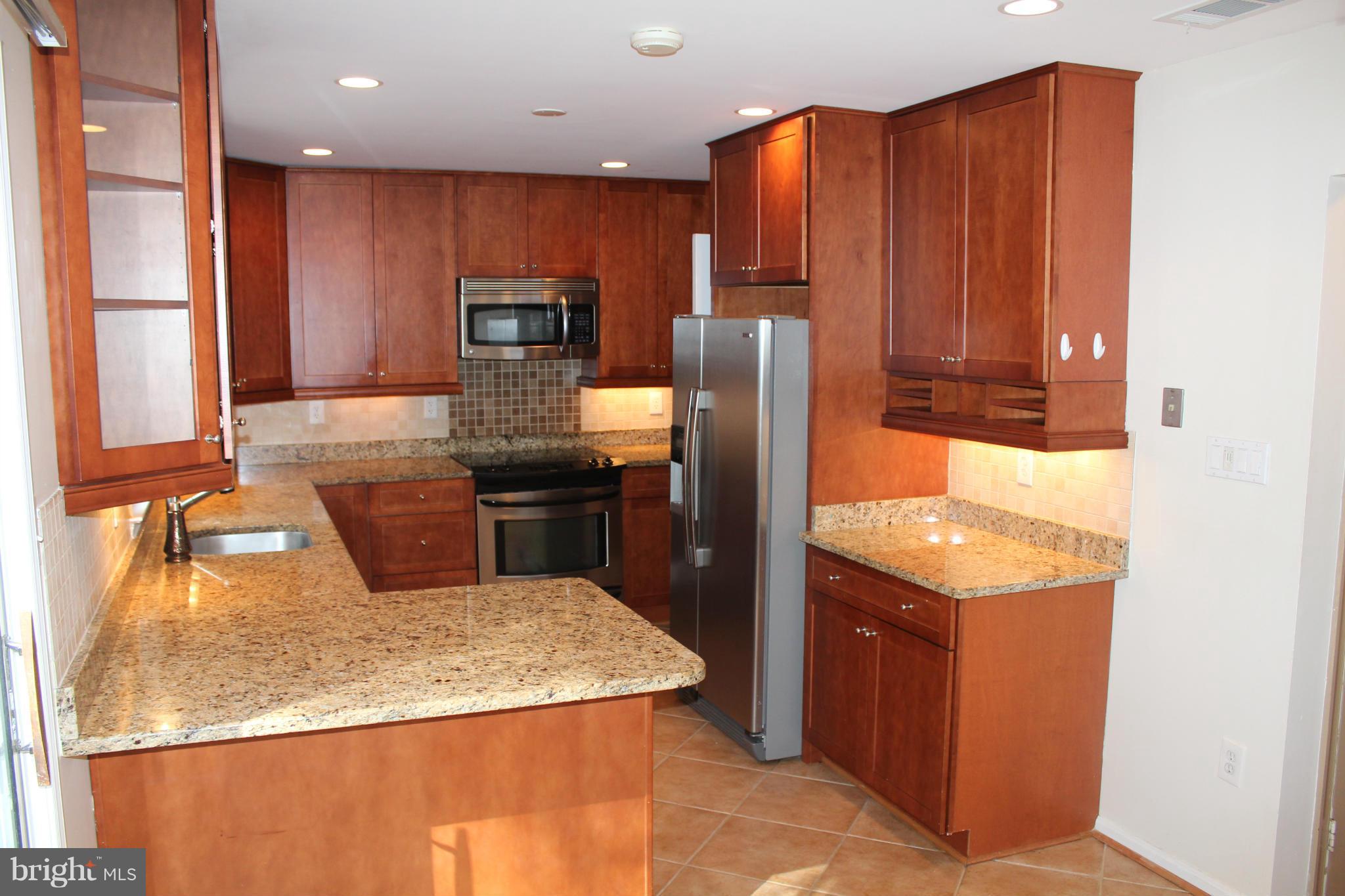 7418 Spring Tree Drive Springfield, VA 22153 - Photo 2 of 30 Kitchen w/ under cabinet lighting