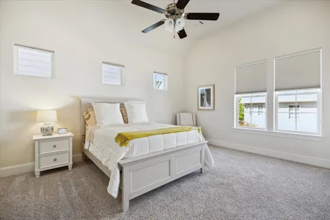 a bedroom with a bed and a lamp