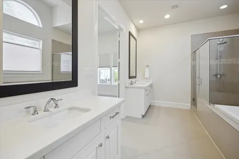 a bedroom with a bed and a lamp on table