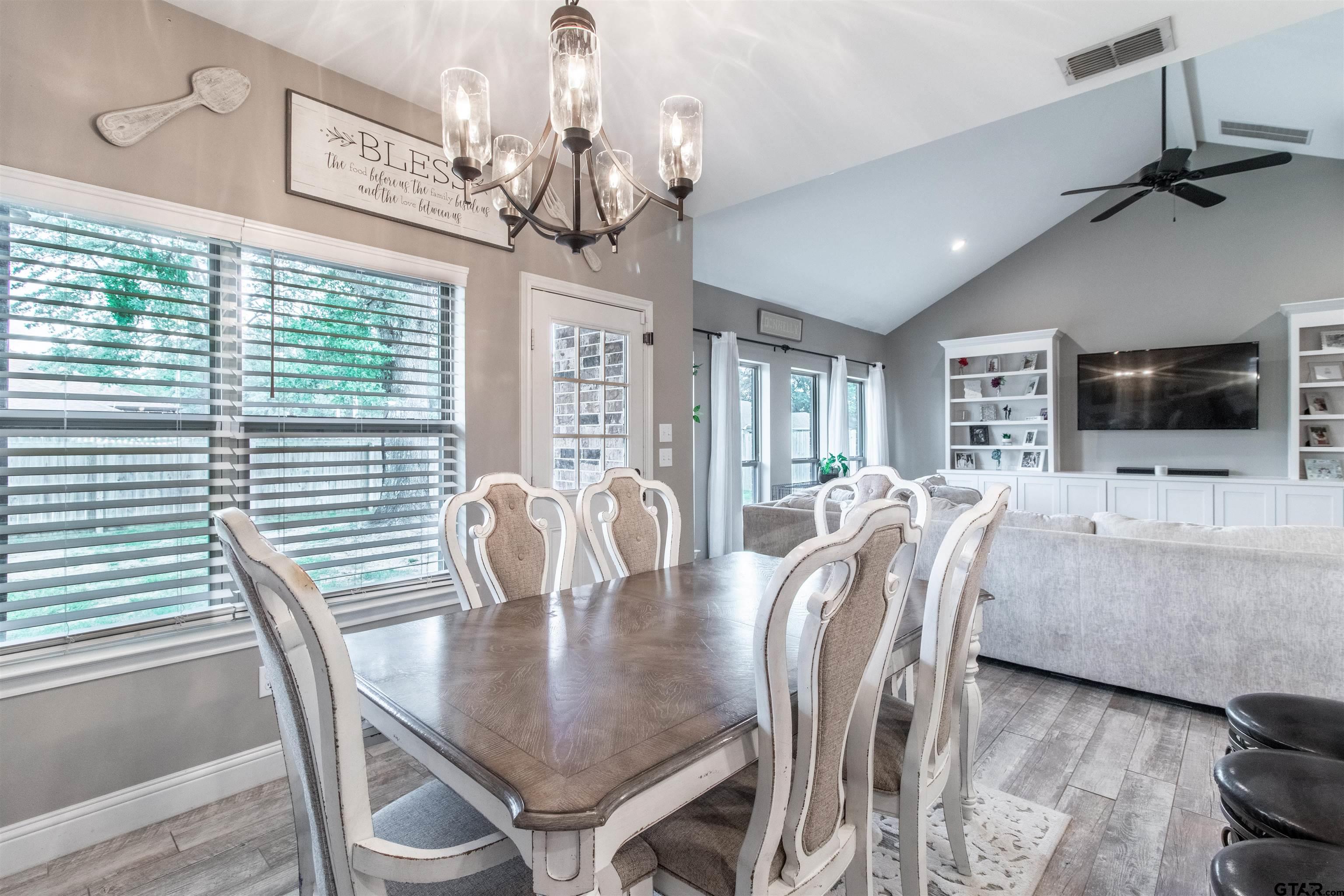 15326 Spring Oaks Drive Lindale, TX 75771 - Photo 14 of 29 a view of a dining room with furniture window and wooden floor