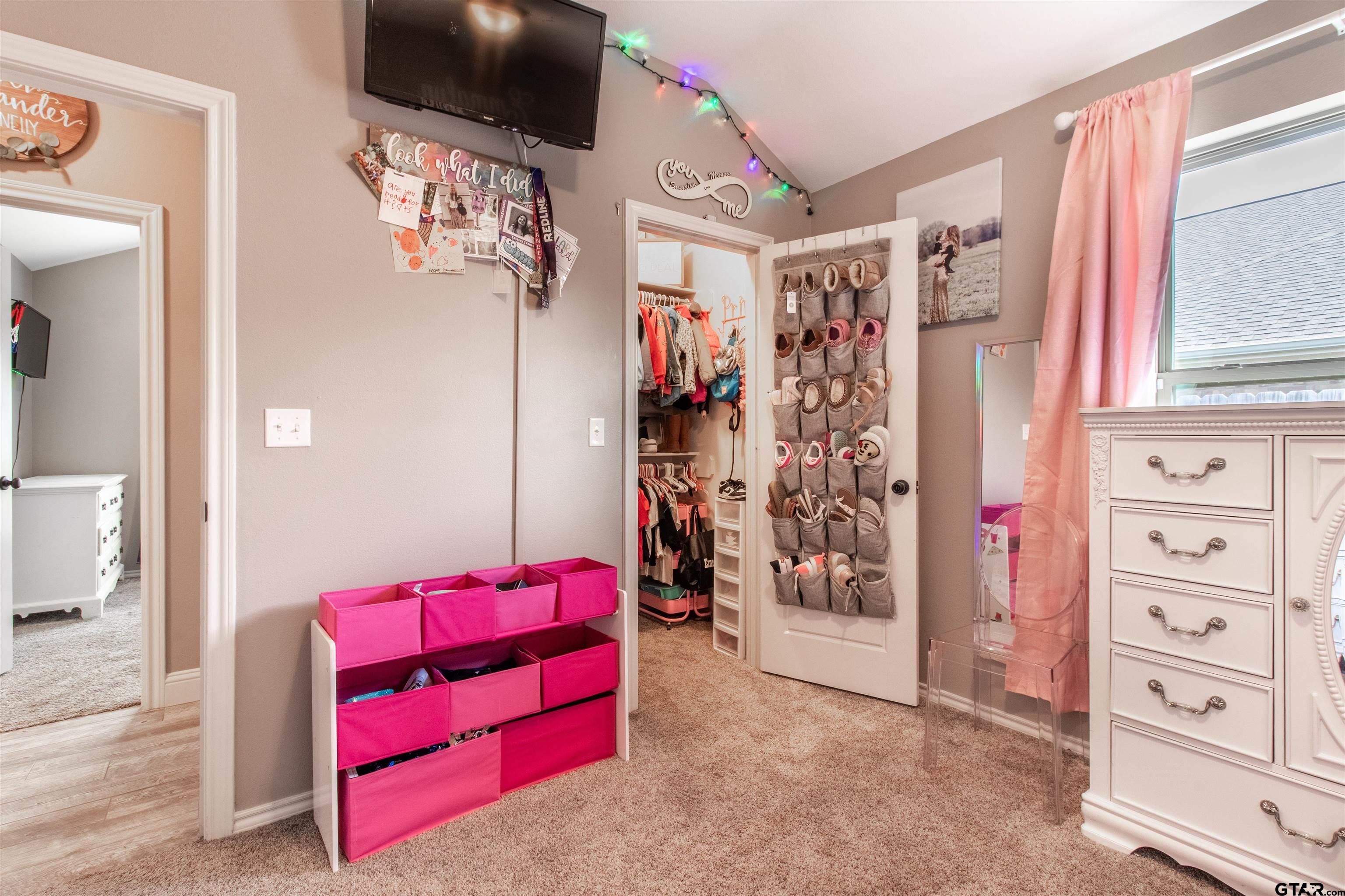 15326 Spring Oaks Drive Lindale, TX 75771 - Photo 24 of 29 a view of walk in closet with clothes and shoes