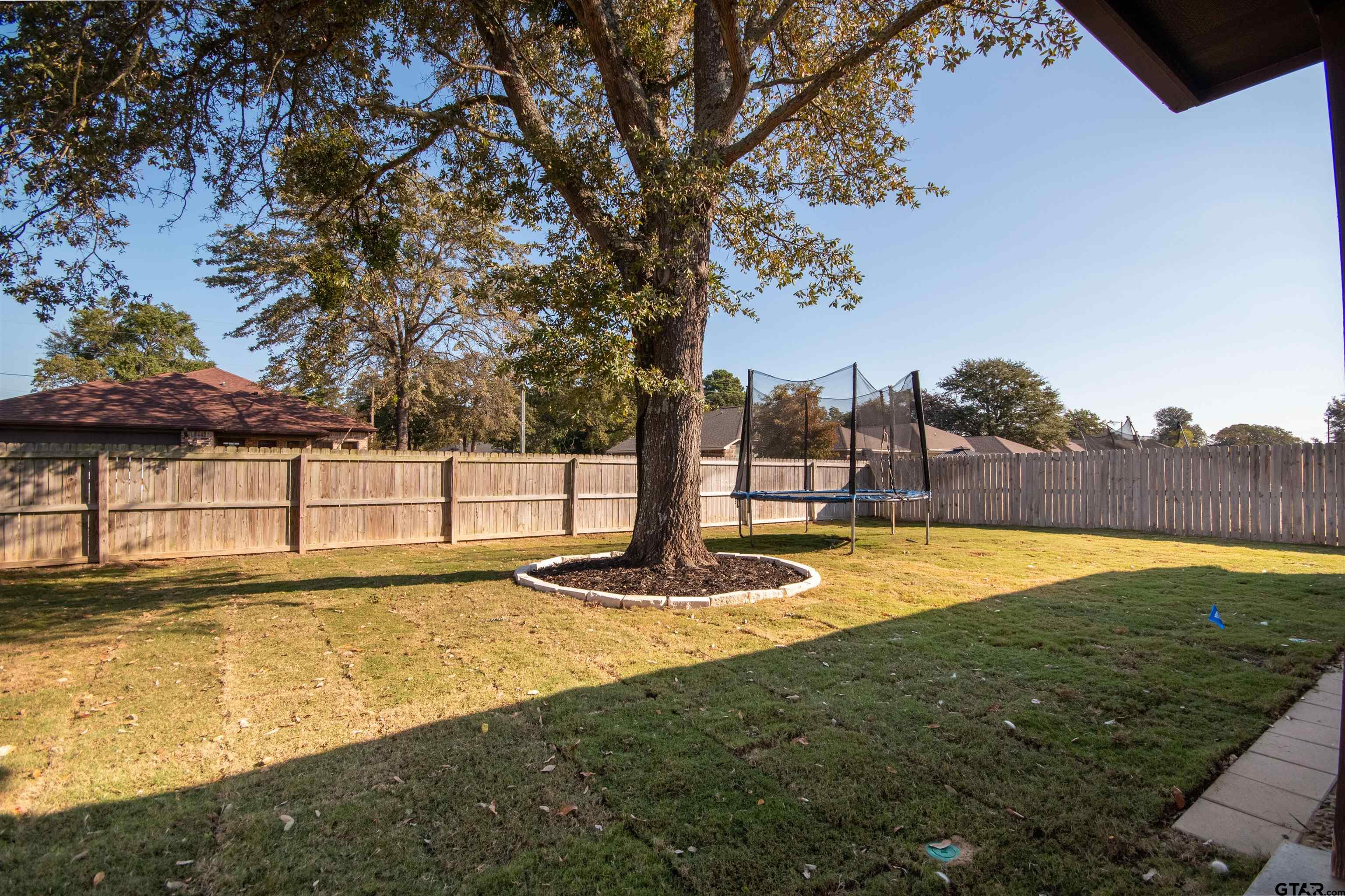 15326 Spring Oaks Drive Lindale, TX 75771 - Photo 28 of 29 a swimming pool with an outdoor space and seating