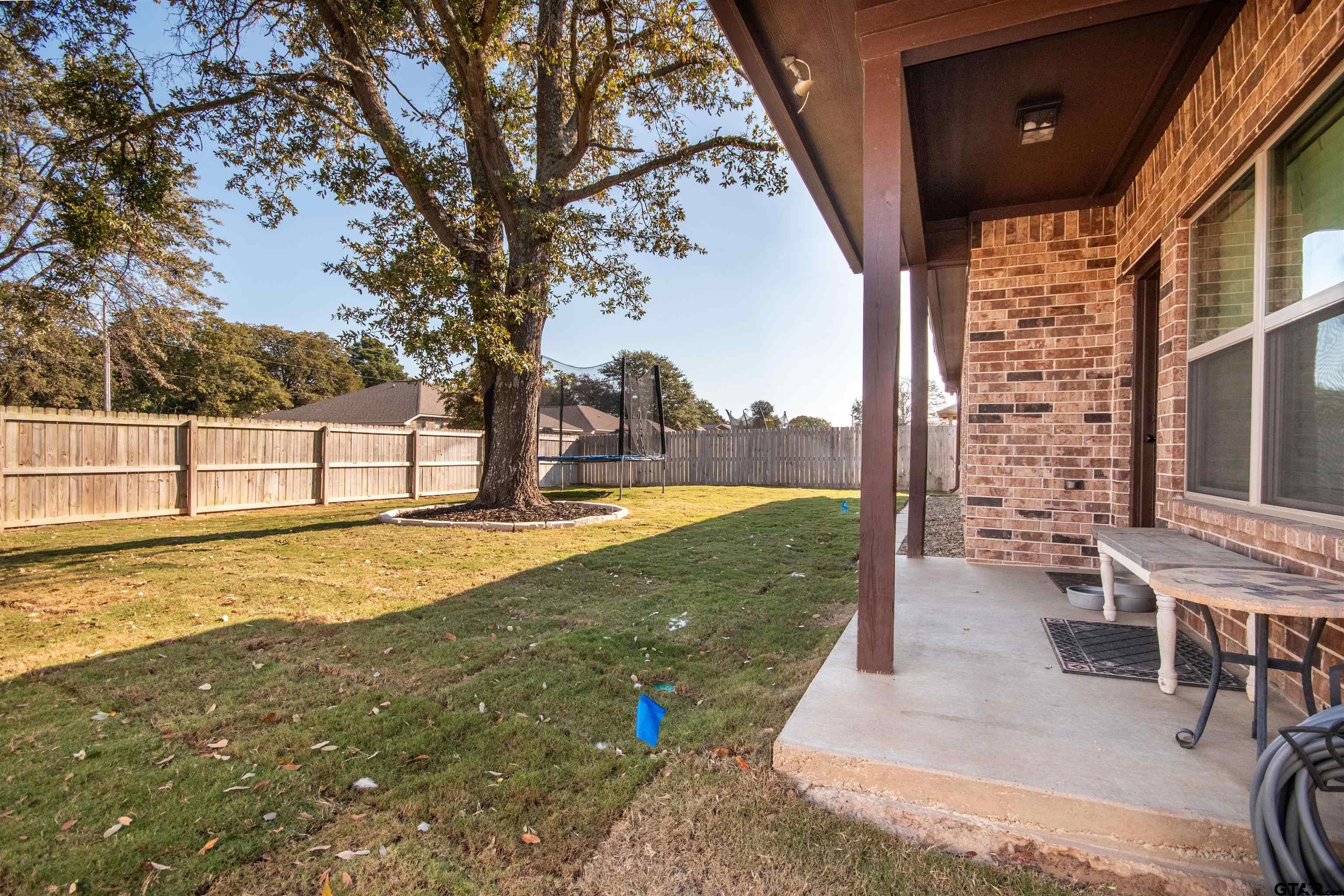 15326 Spring Oaks Drive Lindale, TX 75771 - Photo 29 of 29 a view of a swimming pool with an outdoor seating