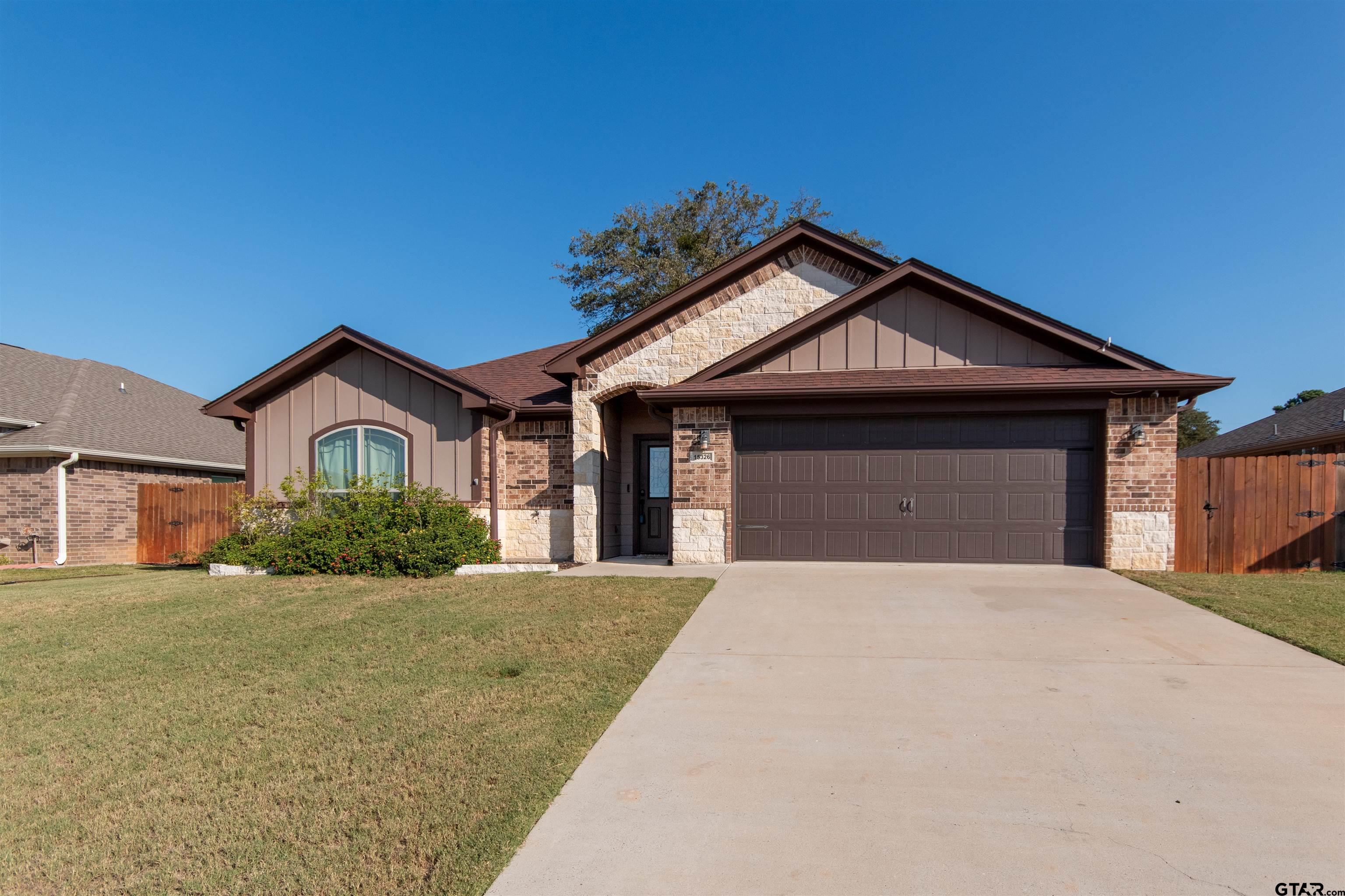 15326 Spring Oaks Drive Lindale, TX 75771 - Photo 3 of 29 a front view of a house with yard and garage