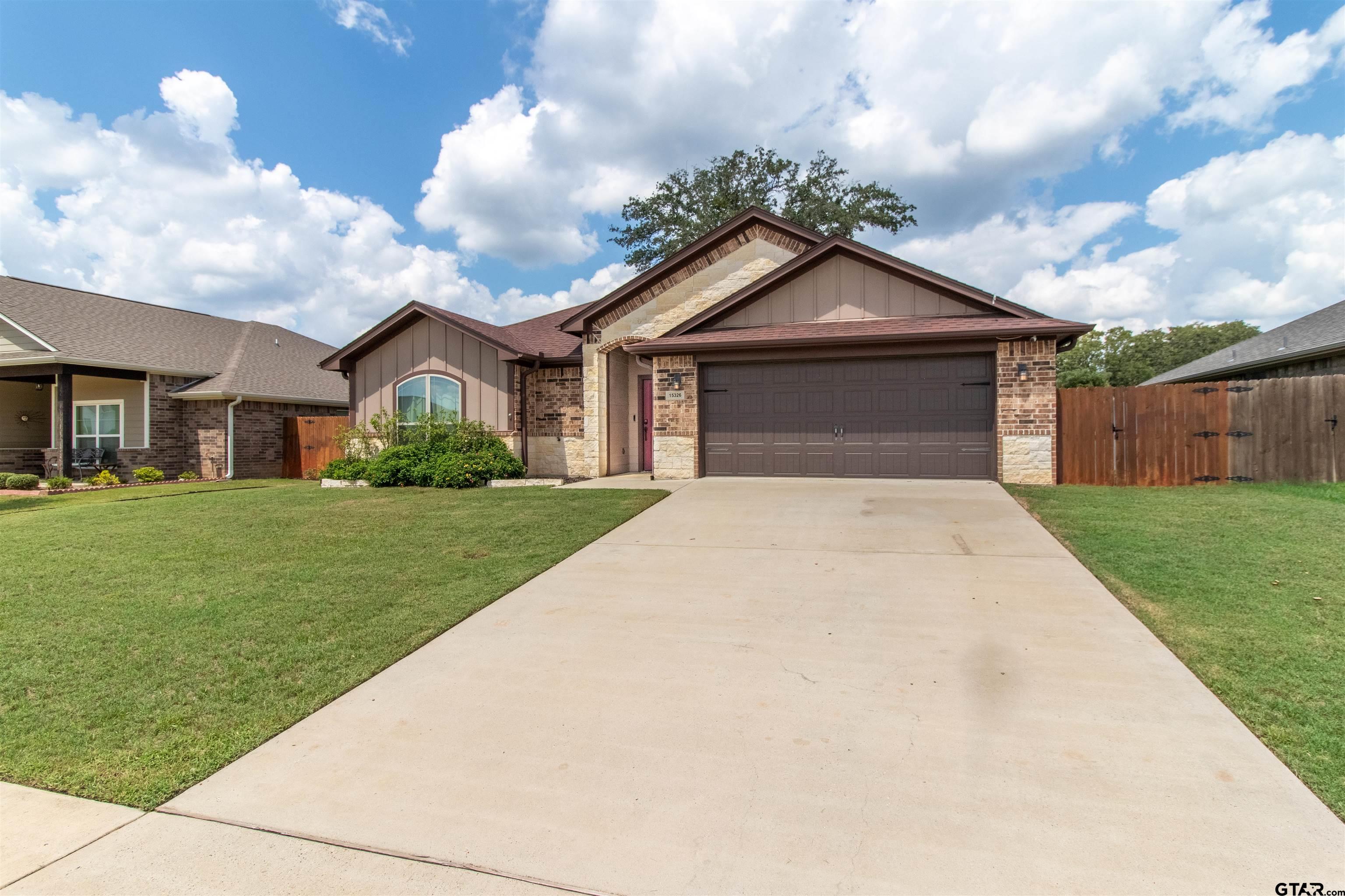 15326 Spring Oaks Drive Lindale, TX 75771 - Photo 4 of 29 a front view of house with yard and green space