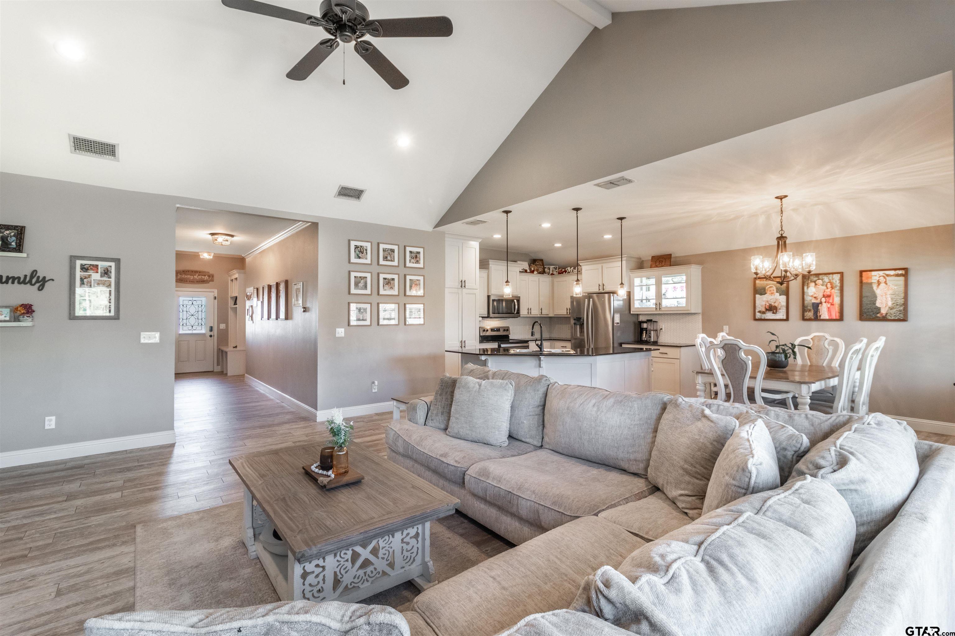 15326 Spring Oaks Drive Lindale, TX 75771 - Photo 8 of 29 a living room with furniture kitchen view and a wooden floor