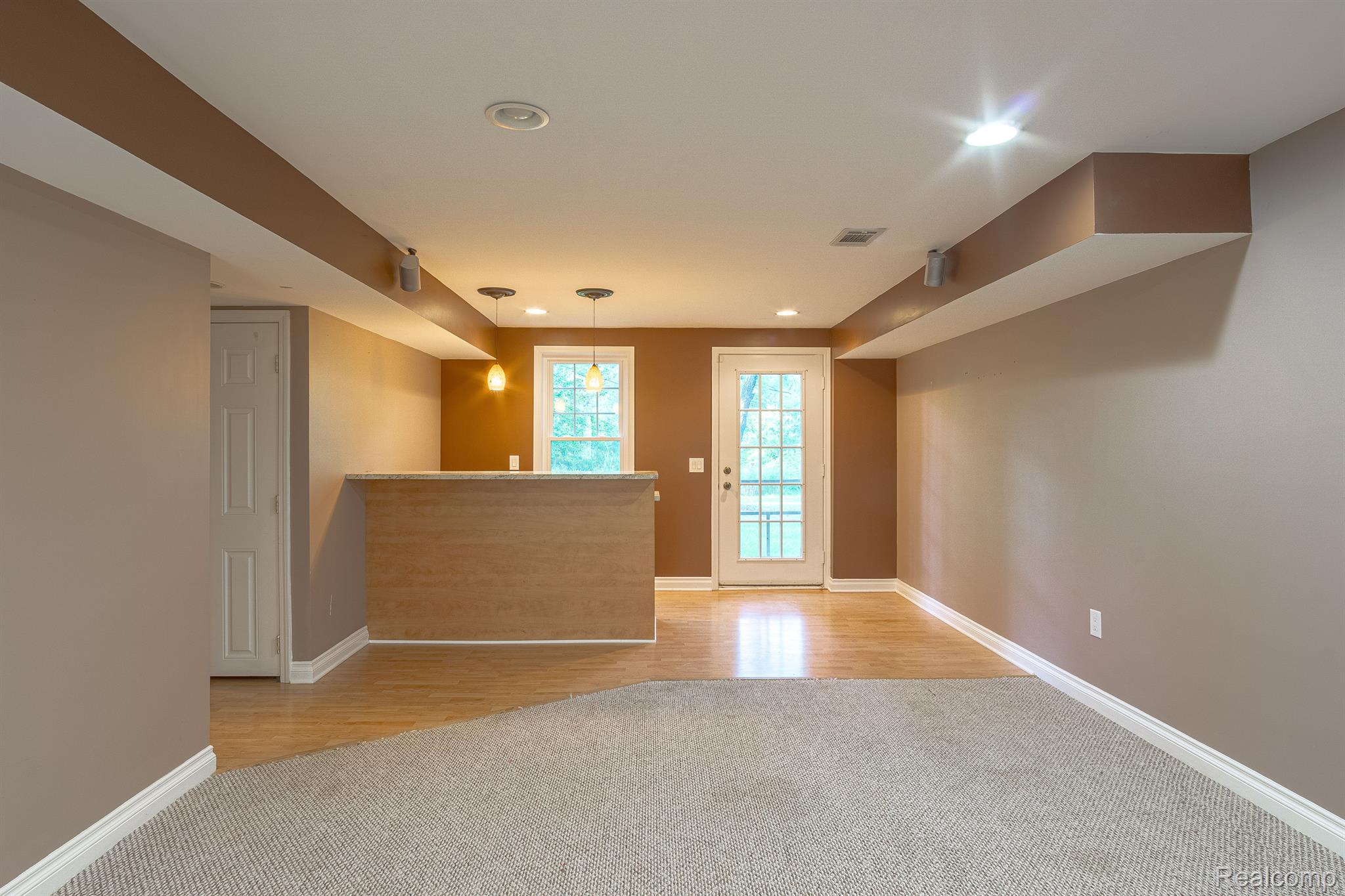 3930 Cullen Road Howell, MI 48855 - Photo 57 of 61 finished walkout lower level with bar