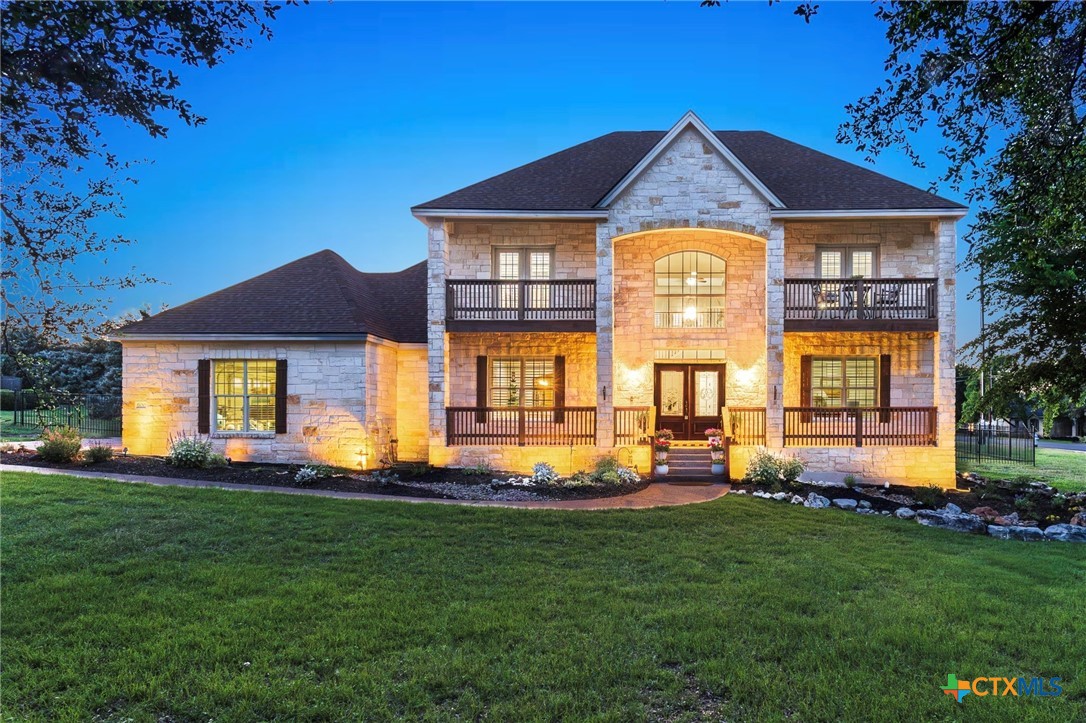 a front view of a house with a yard