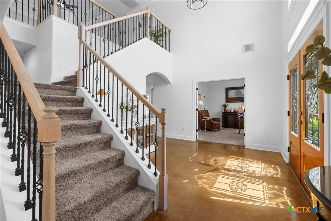 600 Lake Side Cove Georgetown, TX 78628 - Photo 11 of 48 a view of entryway and hall with wooden floor