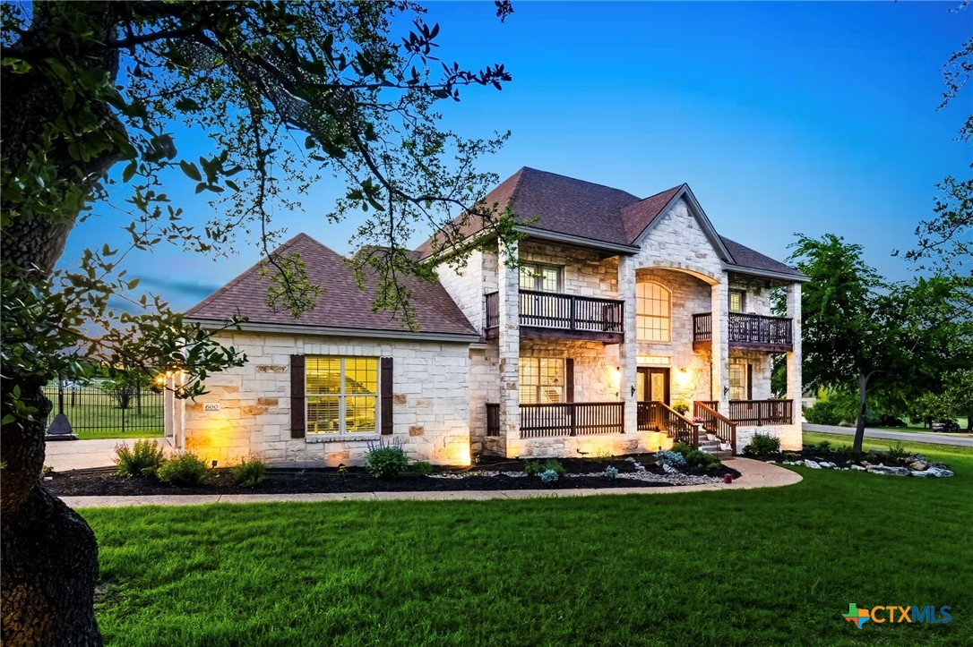 600 Lake Side Cove Georgetown, TX 78628 - Photo 2 of 48 a front view of a house with a yard