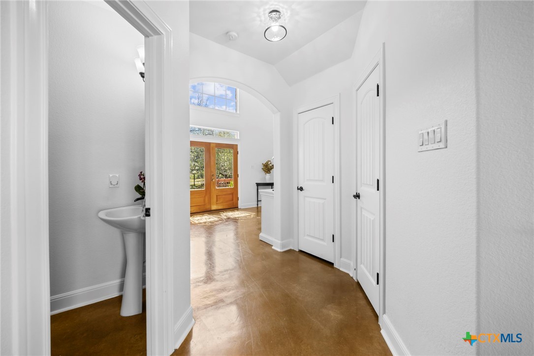 600 Lake Side Cove Georgetown, TX 78628 - Photo 25 of 48 a view of a hallway with wooden floor and closet area
