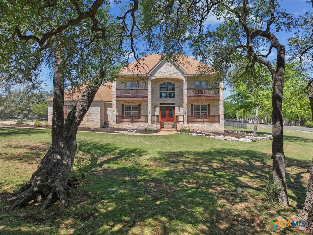 600 Lake Side Cove Georgetown, TX 78628 - Photo 42 of 48 a front view of a house with garden
