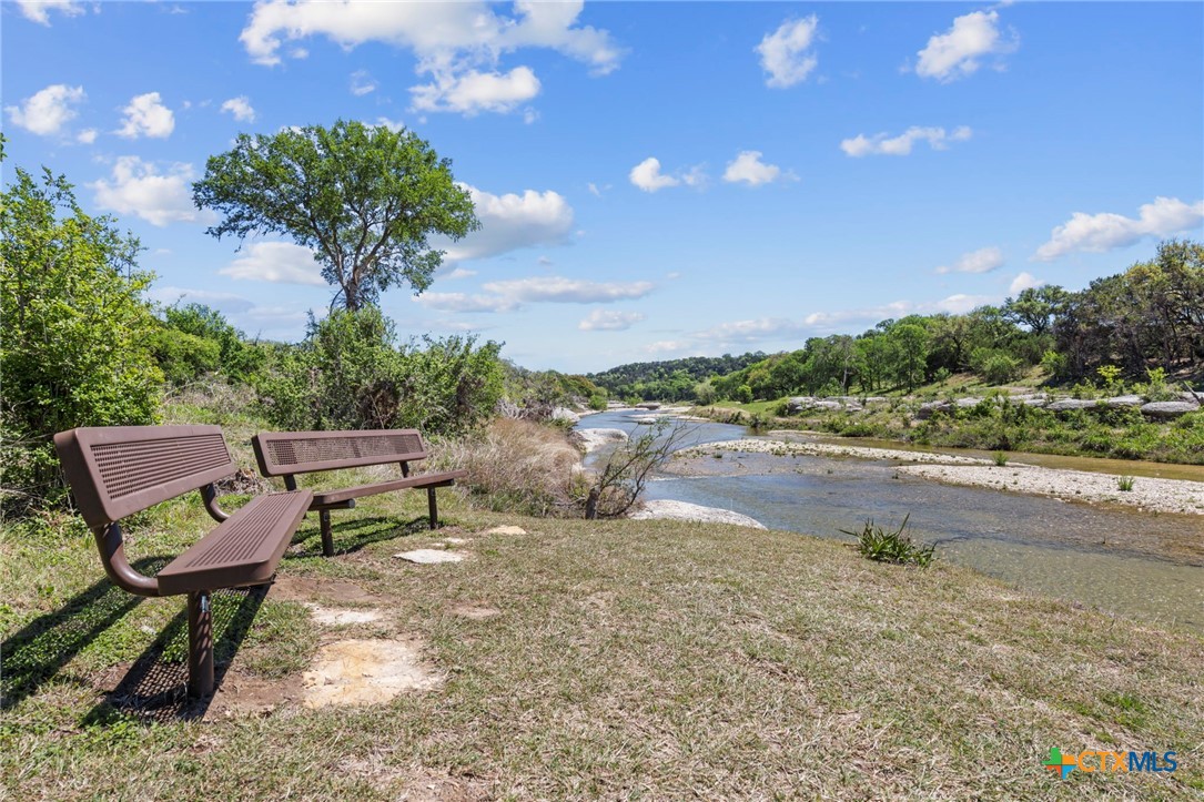 600 Lake Side Cove Georgetown, TX 78628 - Photo 44 of 48 a view of a backyard with sitting area