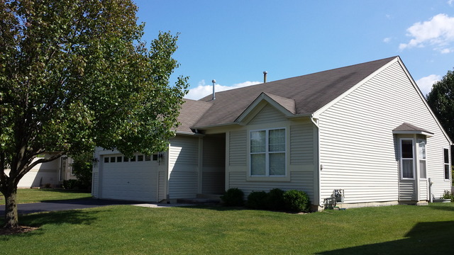 638 Graham Road North Aurora, IL 60542 - Photo 1 of 14 a front view of a house with a garden