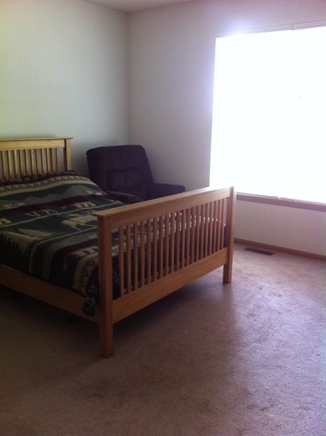 638 Graham Road North Aurora, IL 60542 - Photo 6 of 14 a bedroom with a bed