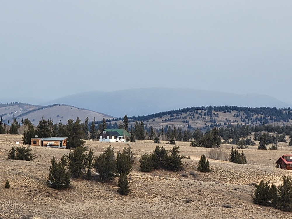 53 Cobb Lane Como, CO 80456 - Photo 27 of 37 a view of a town with snow on the road