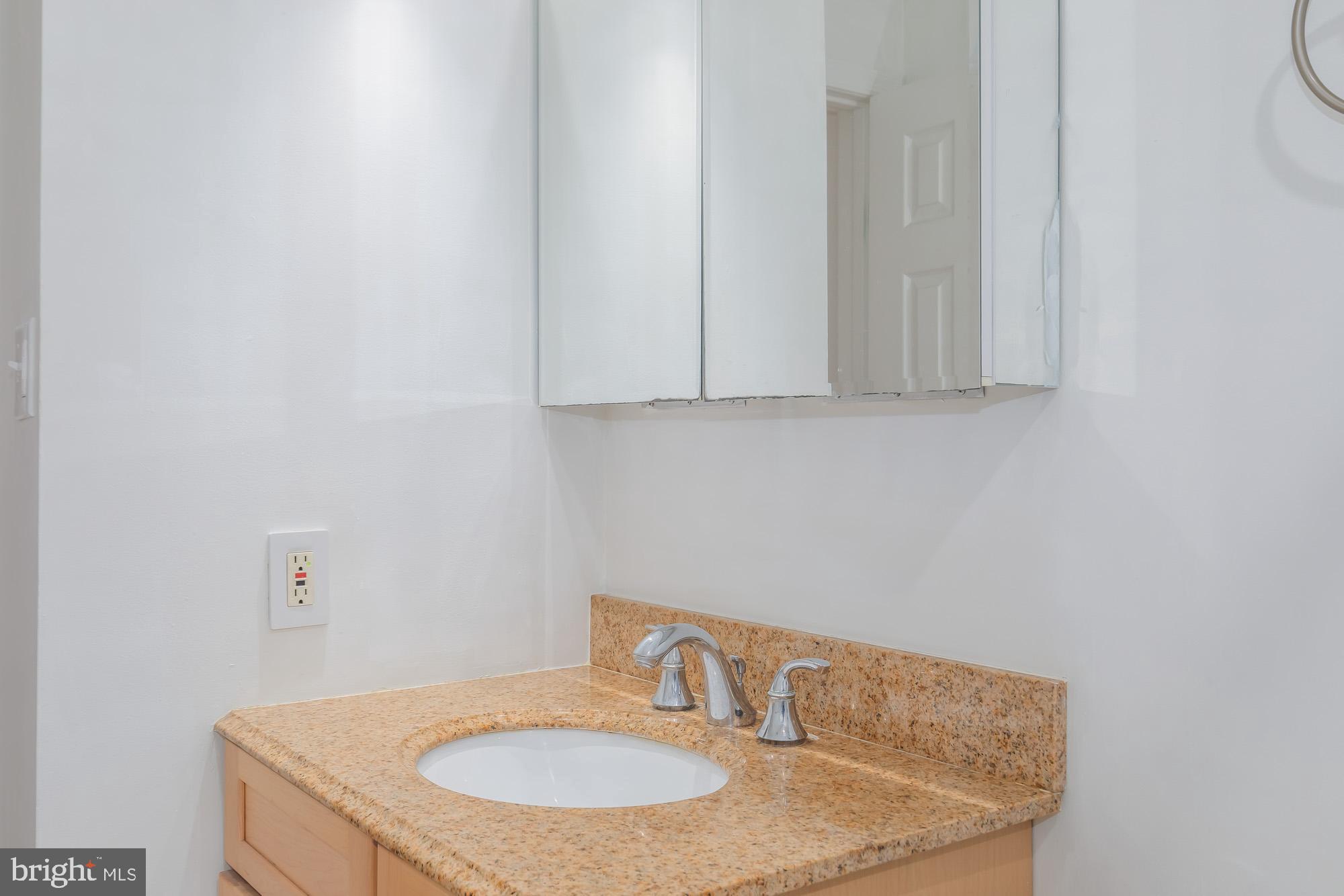 1316 New Hampshire Avenue Northwest, Unit 503 Washington, DC 20036 - Photo 23 of 24 a bathroom with a sink and a vanity