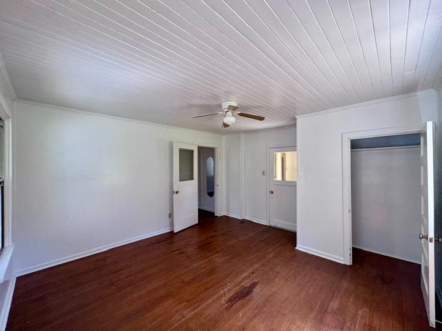 240 Pleasant Street Colfax, CA 95713 - Photo 14 of 26 an empty room with wooden floor and windows