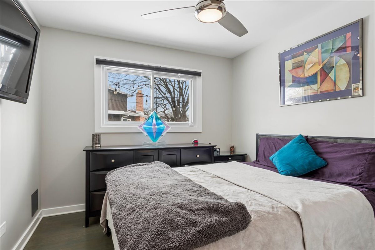 1109 Edson Avenue Lombard, IL 60148 - Photo 13 of 20 a bedroom with a bed and a painting on the wall