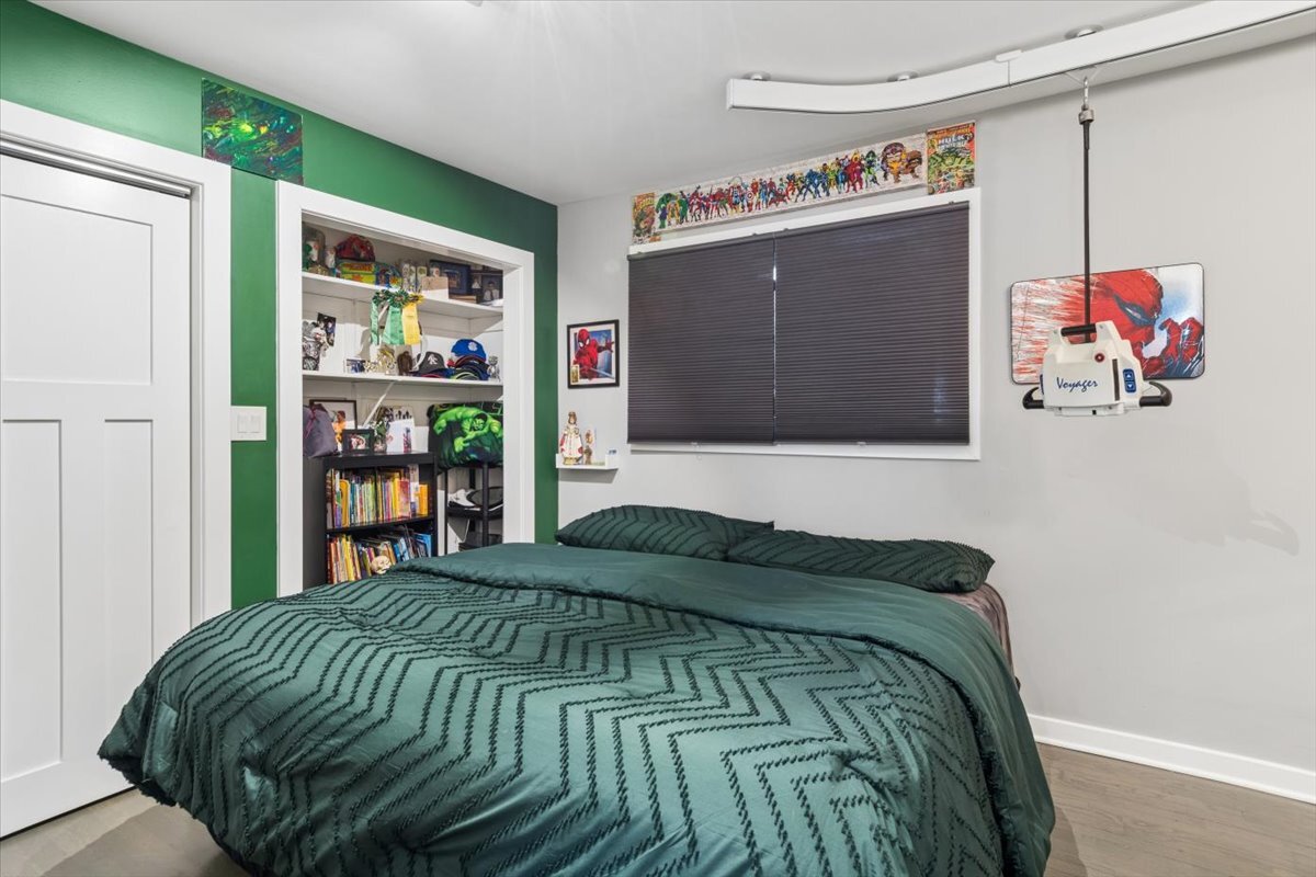 1109 Edson Avenue Lombard, IL 60148 - Photo 14 of 20 a bedroom with a bed and a painting on the wall