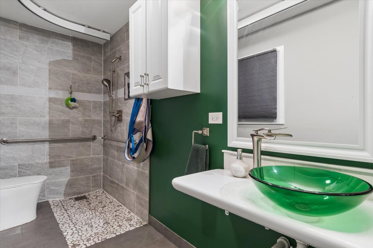 1109 Edson Avenue Lombard, IL 60148 - Photo 15 of 20 a bathroom with a sink a toilet and a mirror
