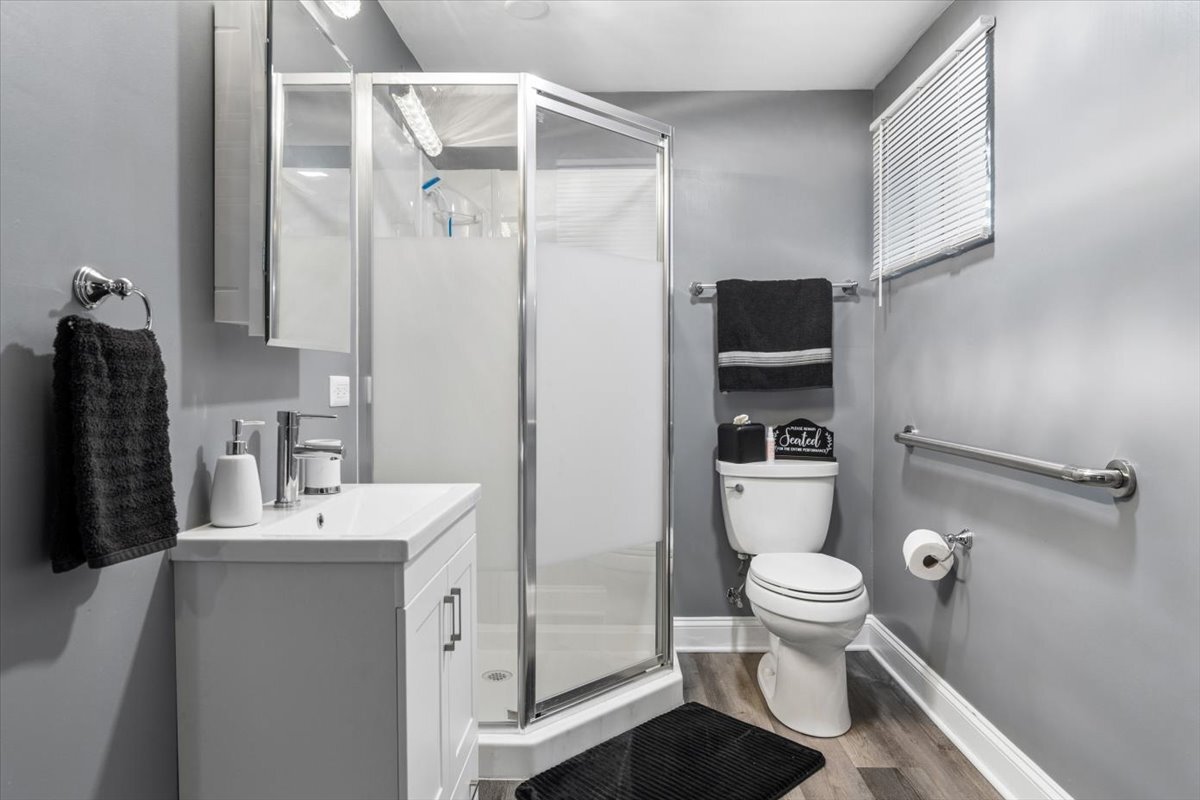 1109 Edson Avenue Lombard, IL 60148 - Photo 18 of 20 a bathroom with a sink a toilet a tub and shower