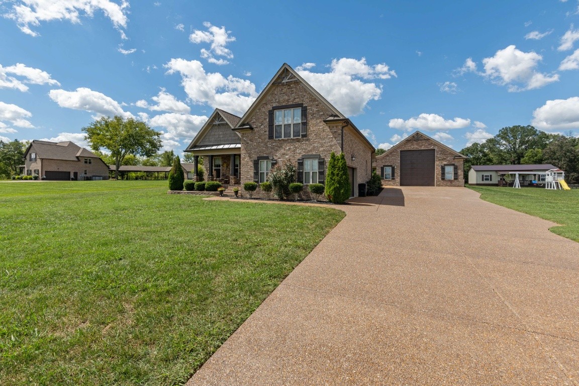 810 Burford Road Lebanon, TN 37087 - Photo 1 of 32 a front view of a house with a yard and trees