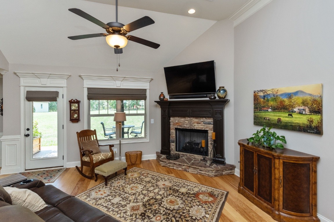 810 Burford Road Lebanon, TN 37087 - Photo 11 of 32 a living room with furniture a flat screen tv and a fireplace