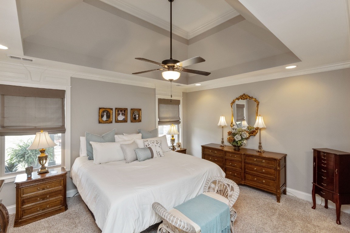 810 Burford Road Lebanon, TN 37087 - Photo 13 of 32 a bedroom with a bed and a chandelier