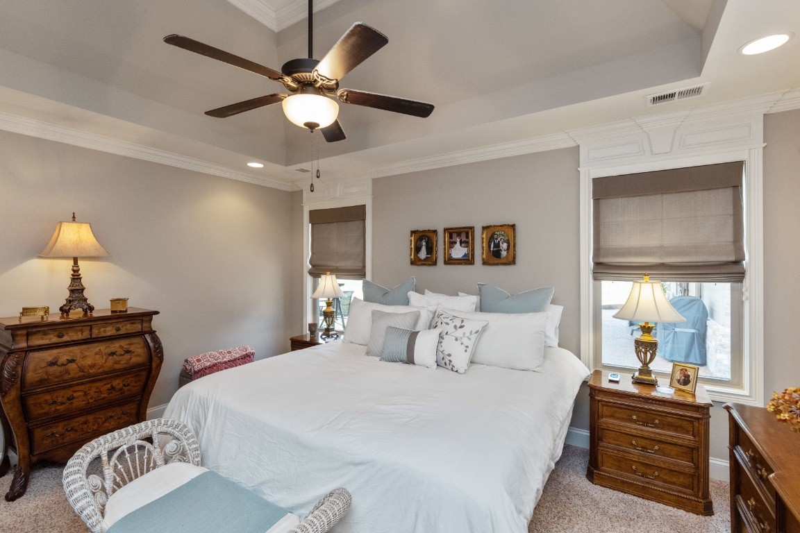 810 Burford Road Lebanon, TN 37087 - Photo 14 of 32 a bedroom with a bed and a chandelier
