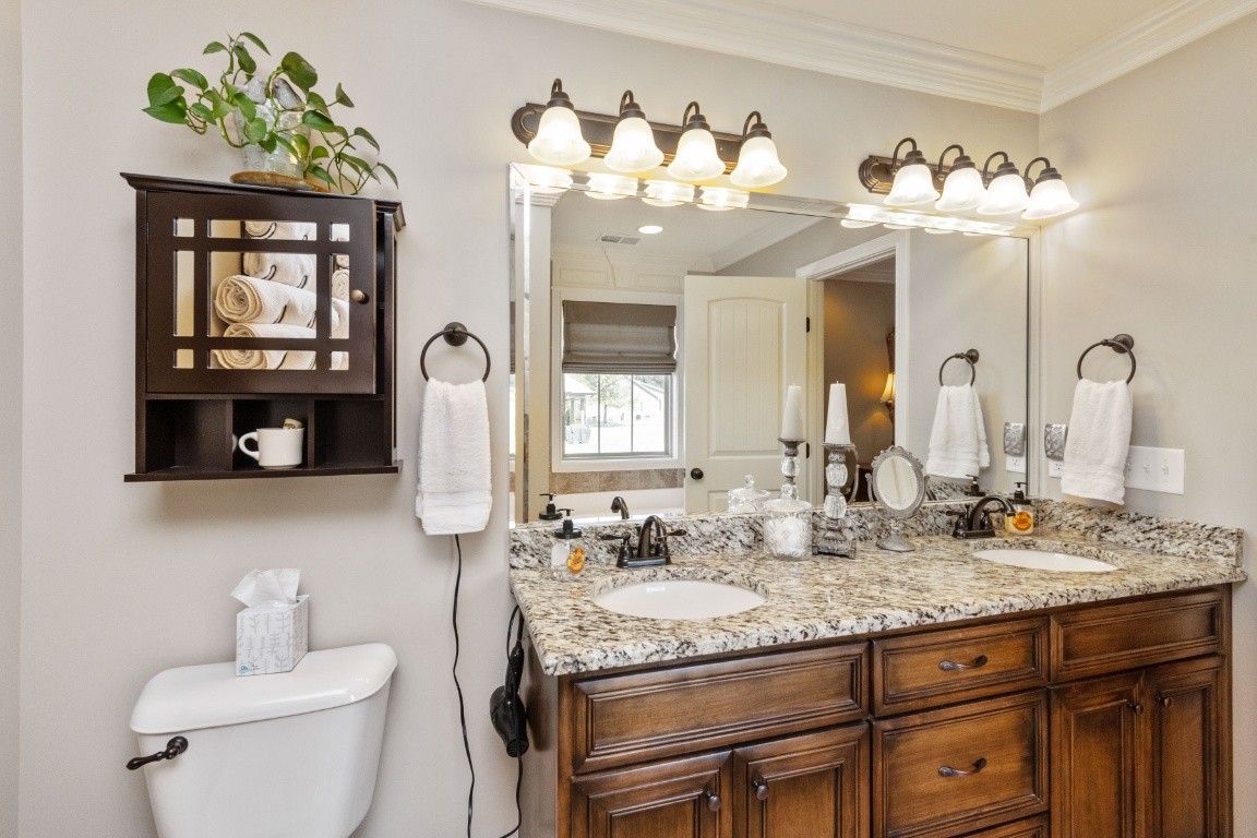 810 Burford Road Lebanon, TN 37087 - Photo 15 of 32 a bathroom with a granite countertop sink a toilet and a mirror