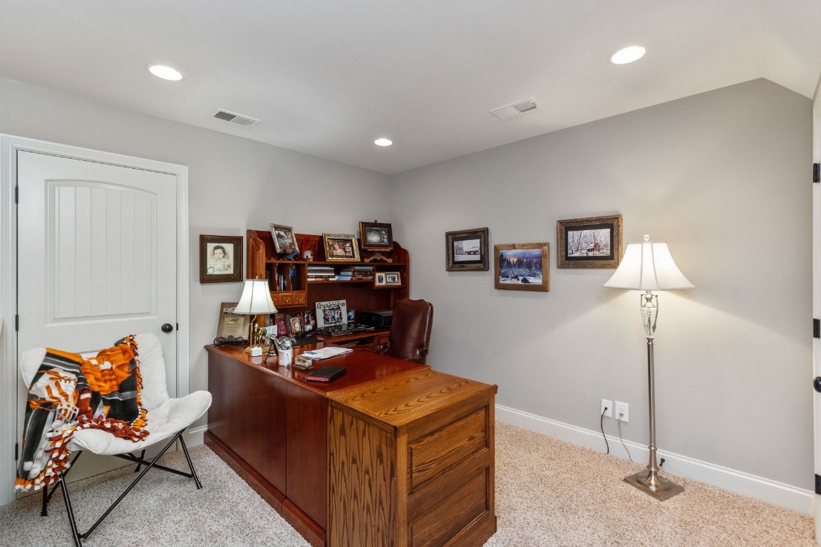 810 Burford Road Lebanon, TN 37087 - Photo 17 of 32 a living room with furniture a flat screen tv and gym equipment