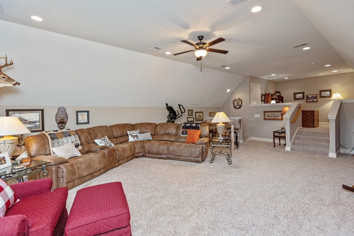 810 Burford Road Lebanon, TN 37087 - Photo 19 of 32 a living room with furniture and a chandelier