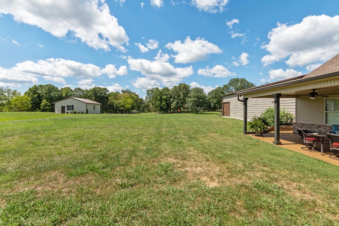 810 Burford Road Lebanon, TN 37087 - Photo 28 of 32 a view of a patio with table and chairs and potted plants