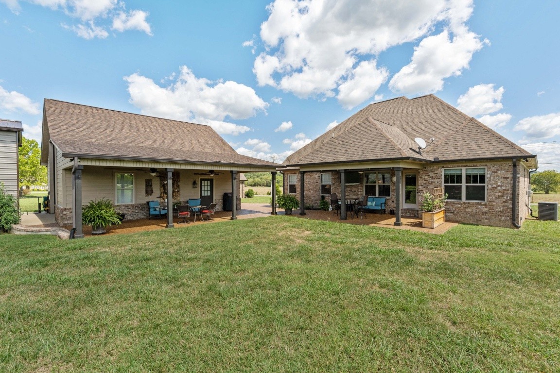 810 Burford Road Lebanon, TN 37087 - Photo 29 of 32 a front view of a house with a garden and porch