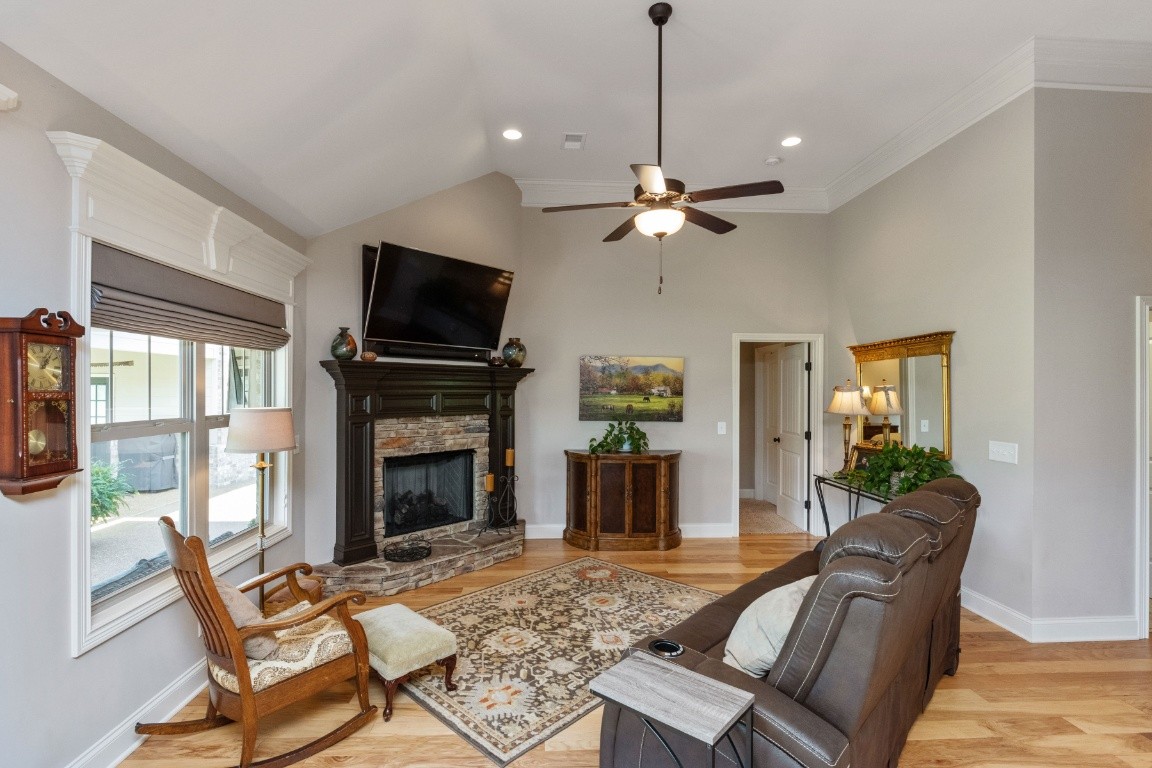 810 Burford Road Lebanon, TN 37087 - Photo 10 of 32 a living room with furniture a flat screen tv and a fireplace