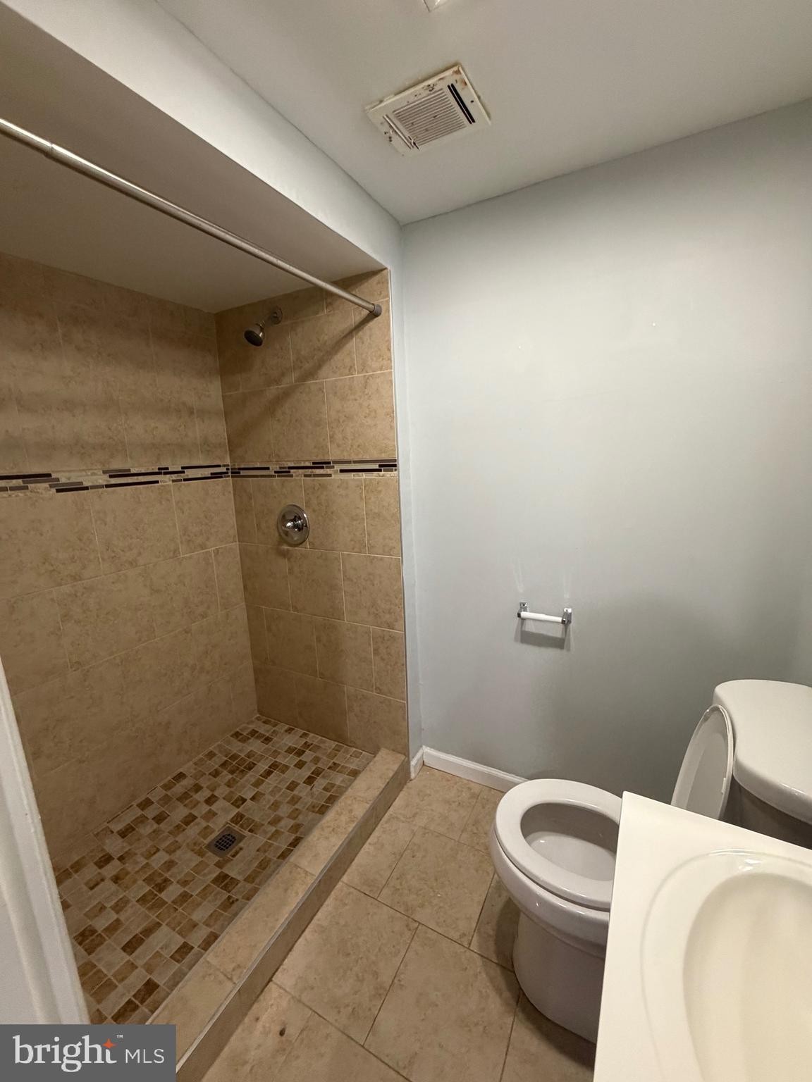 153 Hammershire Road, Unit C Reisterstown, MD 21136 - Photo 12 of 20 a bathroom with a toilet and a shower