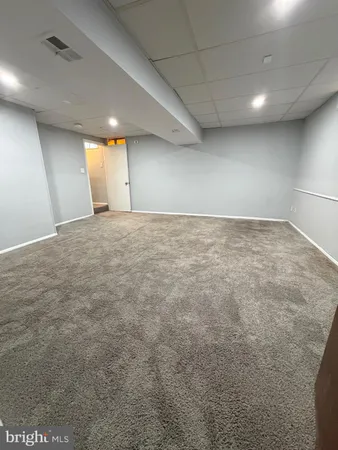 a view of an empty room and stairs