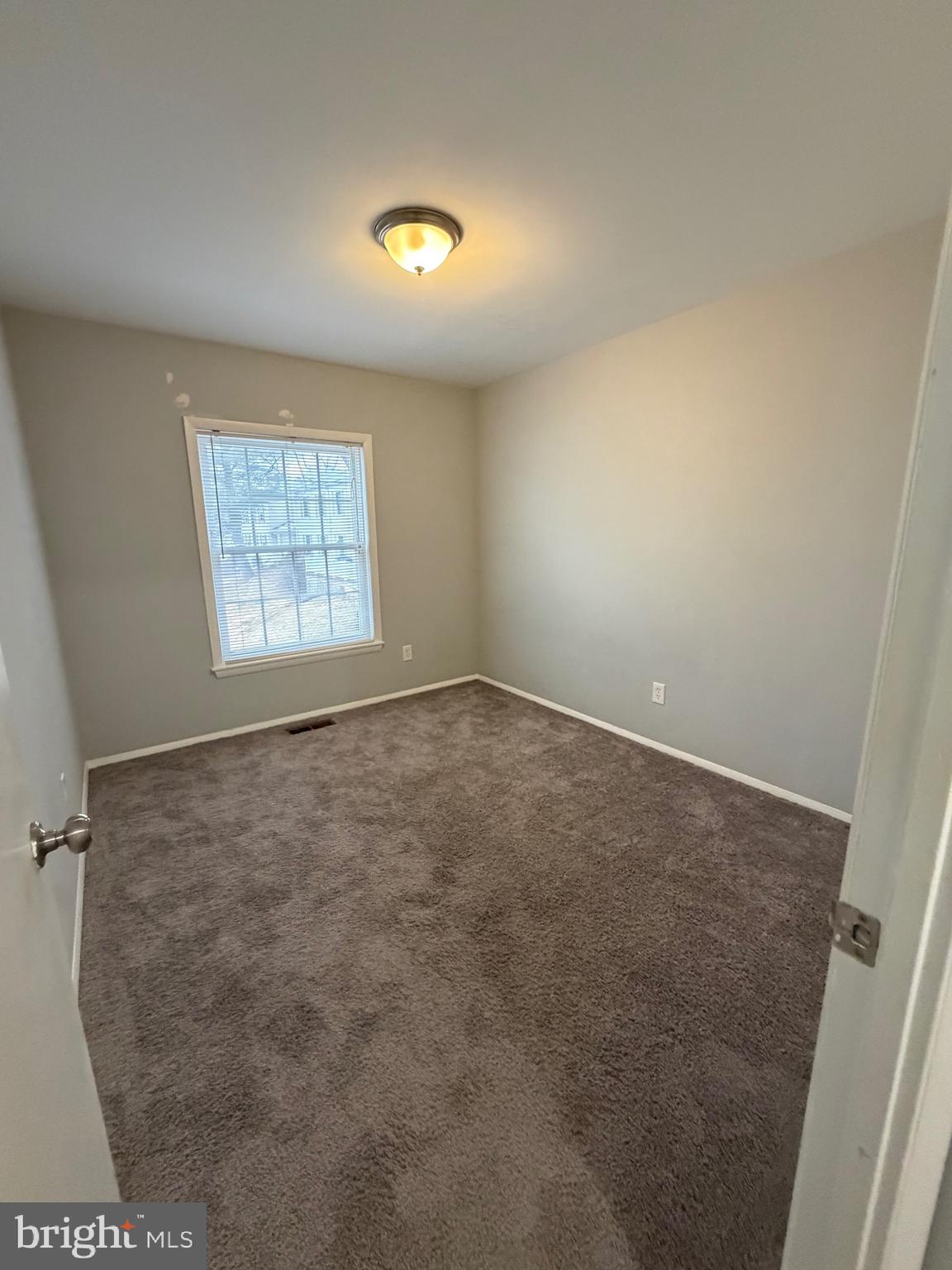 153 Hammershire Road, Unit C Reisterstown, MD 21136 - Photo 18 of 20 an empty room with windows