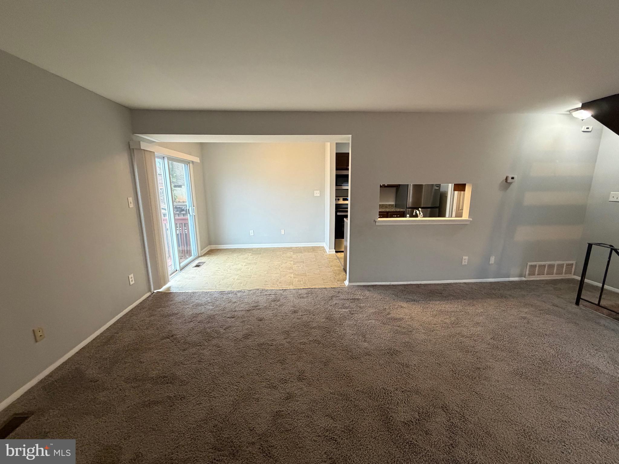 153 Hammershire Road, Unit C Reisterstown, MD 21136 - Photo 2 of 20 an empty room with windows and entrance