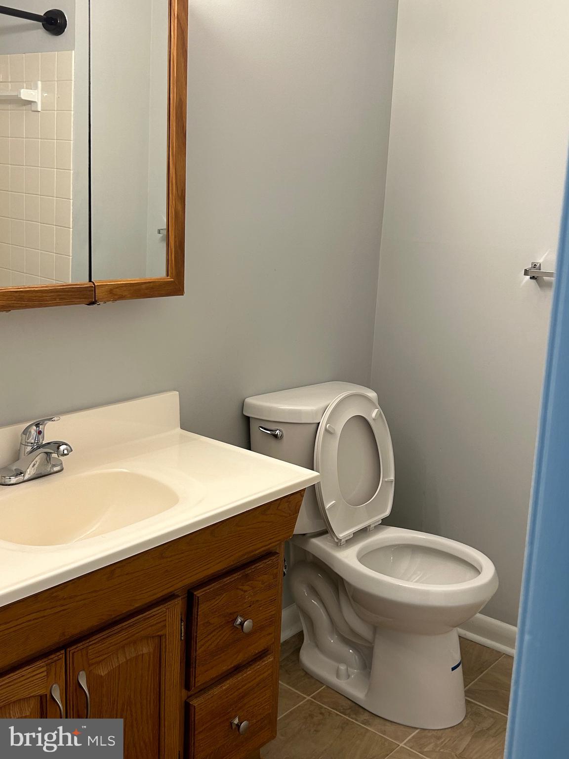 153 Hammershire Road, Unit C Reisterstown, MD 21136 - Photo 4 of 12 a bathroom with a sink and a toilet
