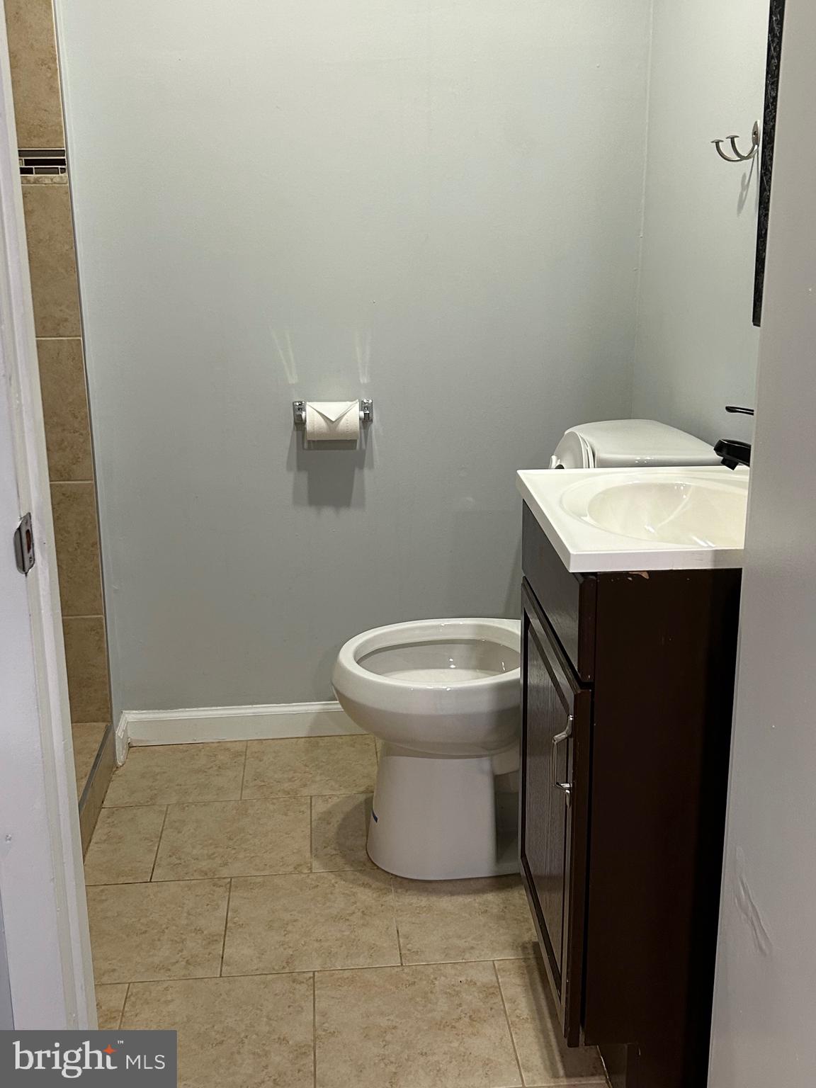 153 Hammershire Road, Unit C Reisterstown, MD 21136 - Photo 7 of 12 a bathroom with a sink toilet and a mirror