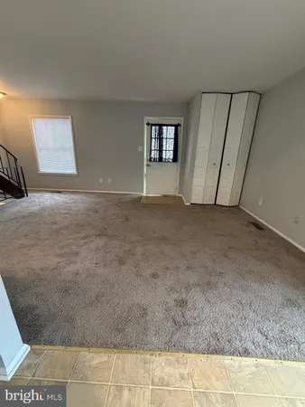 a kitchen with stainless steel appliances granite countertop a refrigerator and a stove