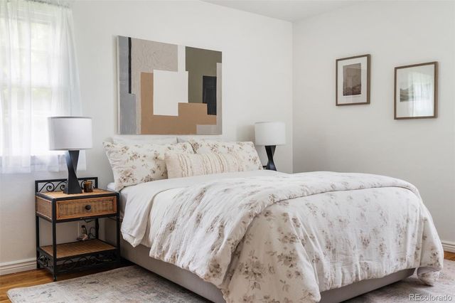 a bedroom with a bed and lamp