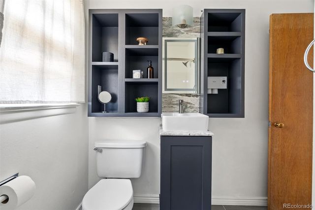 a bathroom with a toilet and a sink